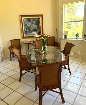 a dining room with furniture and window