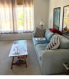 a living room with a couch and a table