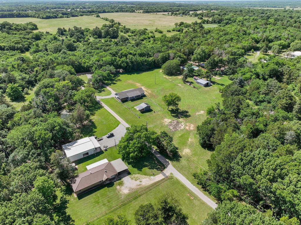 2658 Oak Ridge Road Denison, TX 75021 - Photo 34 of 37 an aerial view of a house with a yard