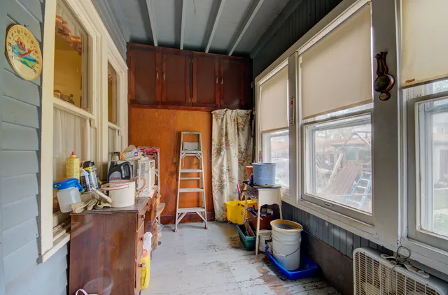 a view of storage and utility room with windows
