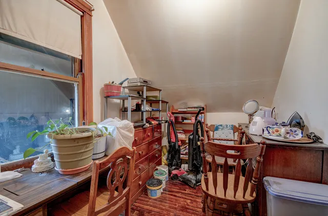 a view of a dining room with furniture and rug