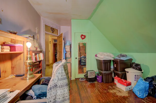 a utility room with dryer washer and a view of living area