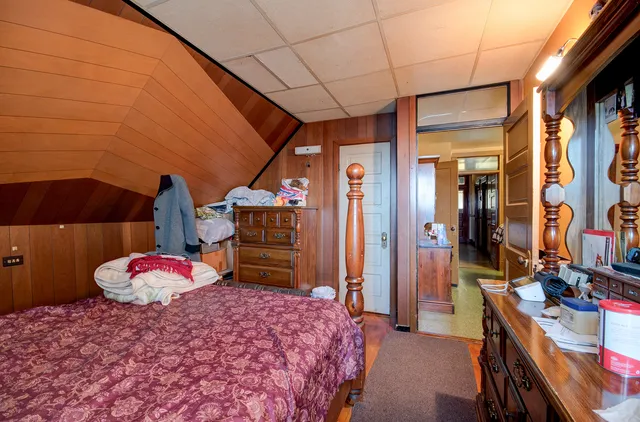 a bedroom with a bed and a closet