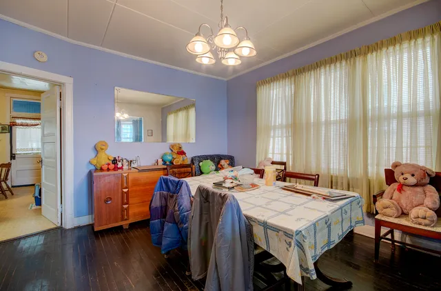 a view of a dining room with furniture and window