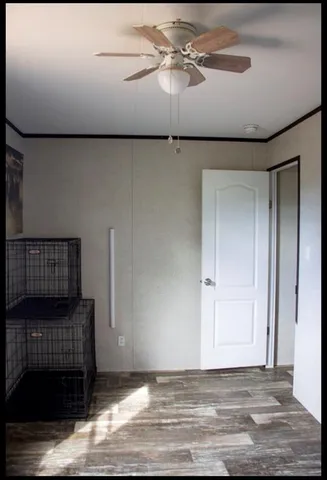 a view of room with wooden floor