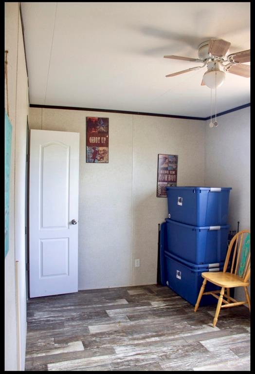 18200 Highway 6 Dublin, TX 76446 - Photo 18 of 38 a view of room with wooden floor