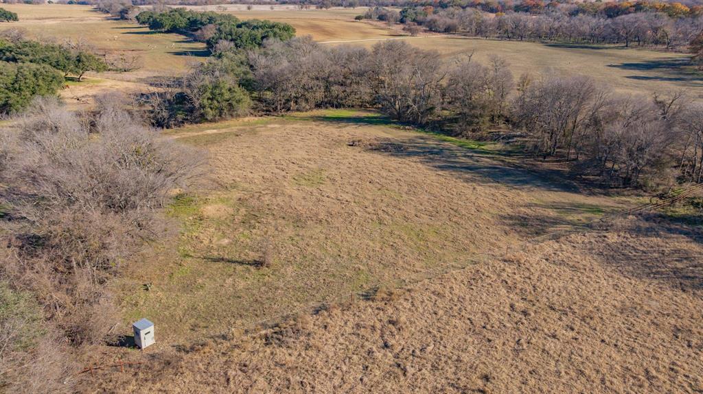 18200 Highway 6 Dublin, TX 76446 - Photo 27 of 38 a view of a dry yard with wooden floor and lake view