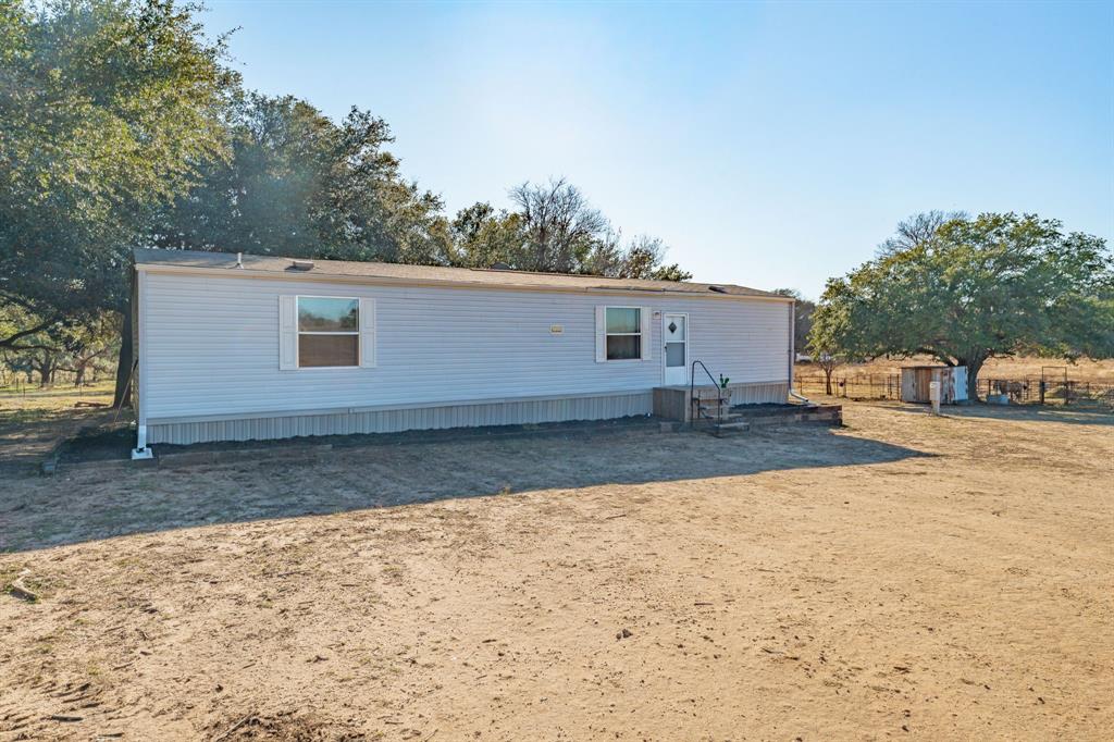 18200 Highway 6 Dublin, TX 76446 - Photo 6 of 38 a front view of a house with a yard