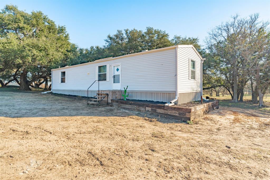18200 Highway 6 Dublin, TX 76446 - Photo 8 of 38 a view of a house with a yard