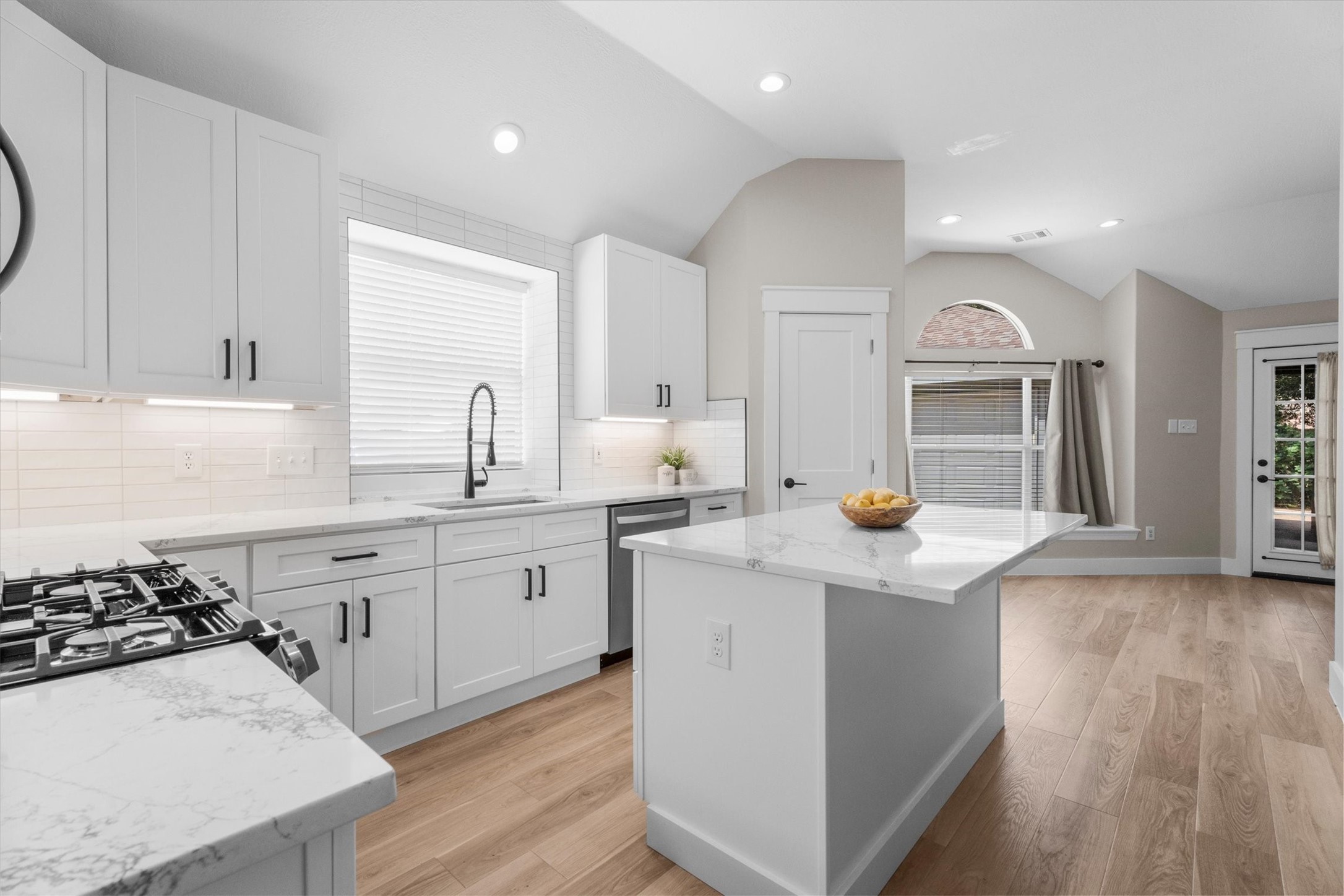 30111 Granum Drive Spring, TX 77386 - Photo 21 of 45 a kitchen with a sink a stove and cabinets
