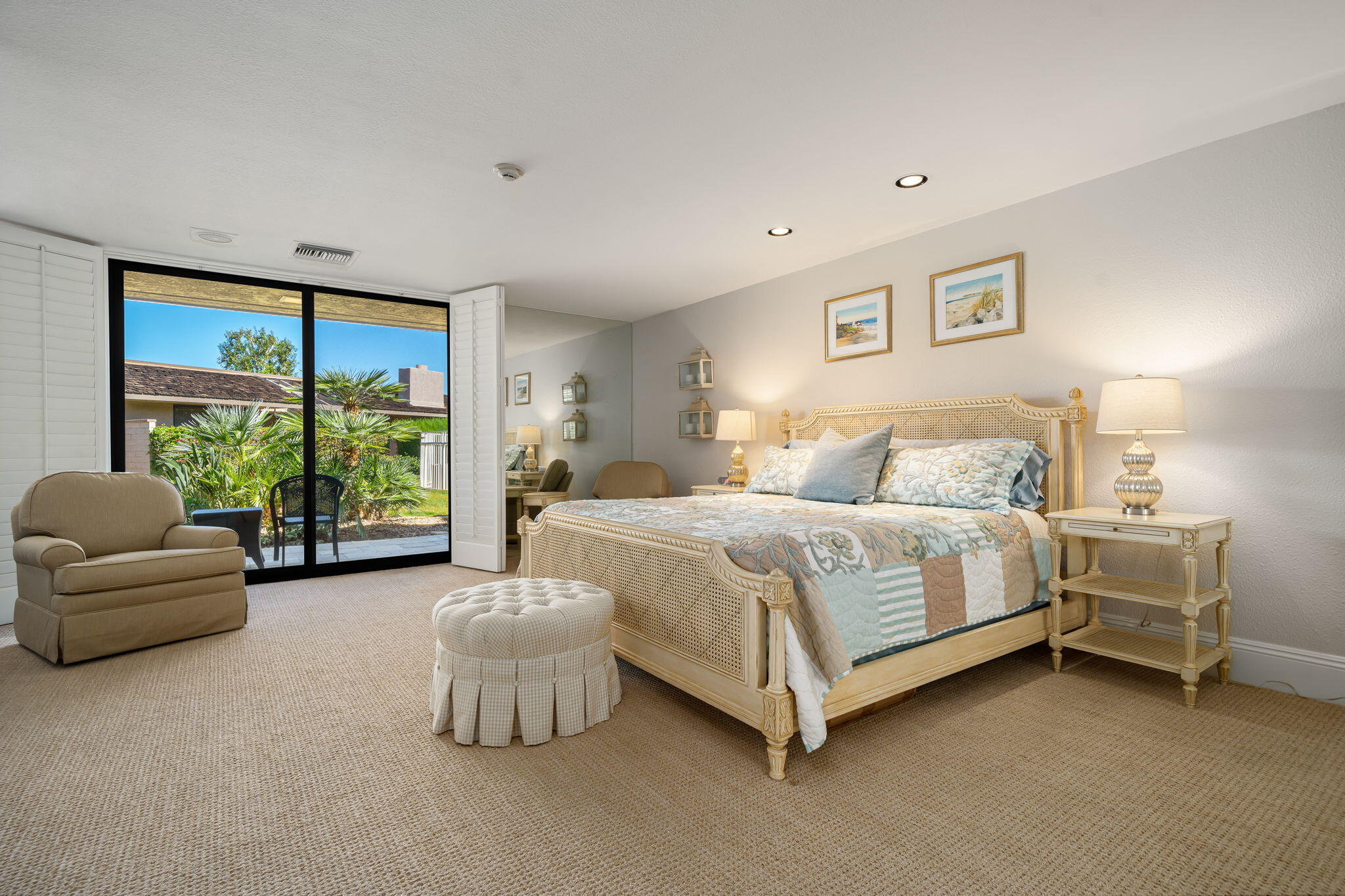 6 Oxford Court Rancho Mirage, CA 92270 - Photo 13 of 42 a bedroom with a bed and a couch