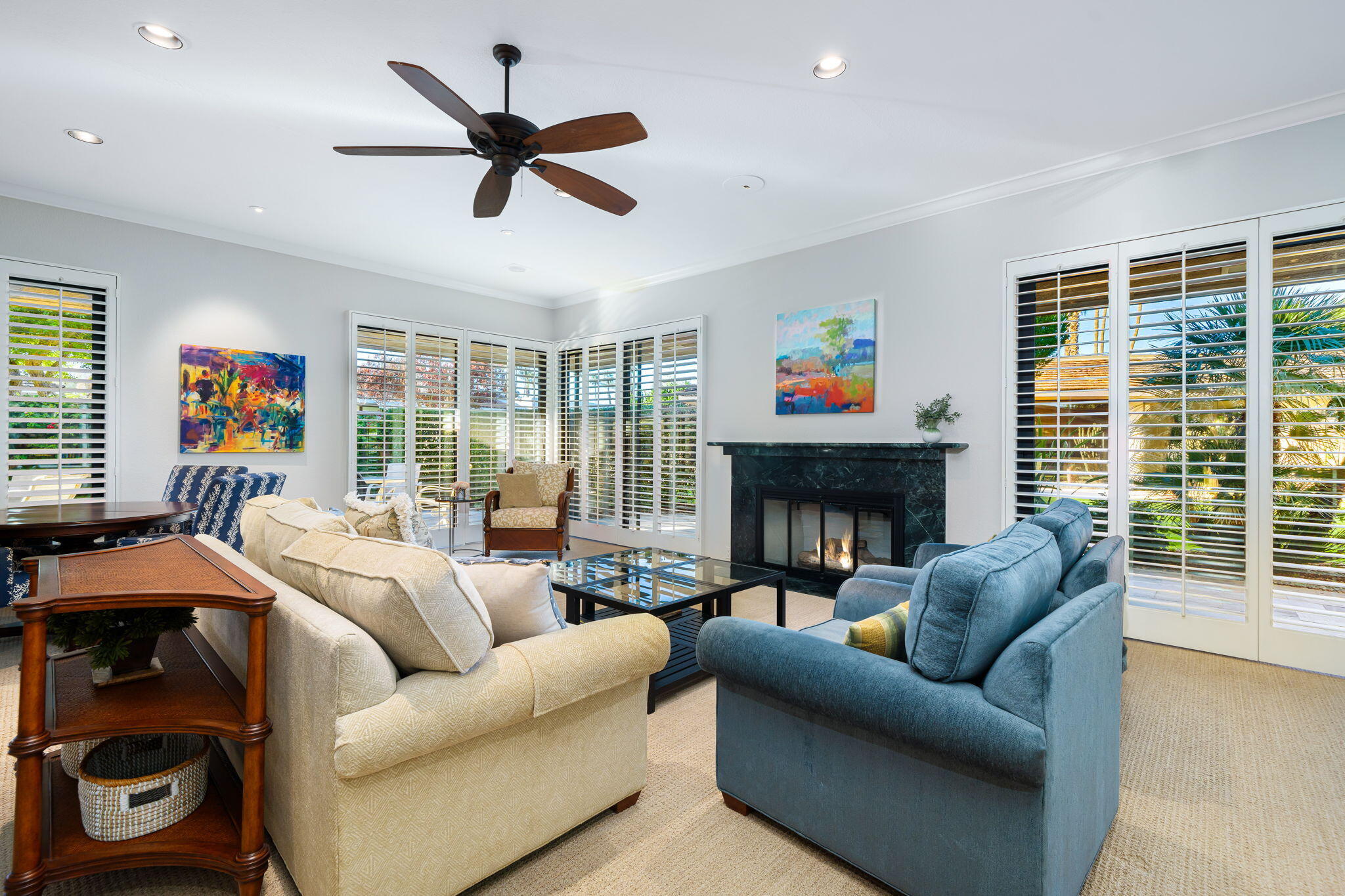 6 Oxford Court Rancho Mirage, CA 92270 - Photo 2 of 42 a living room with furniture a fireplace and a large window