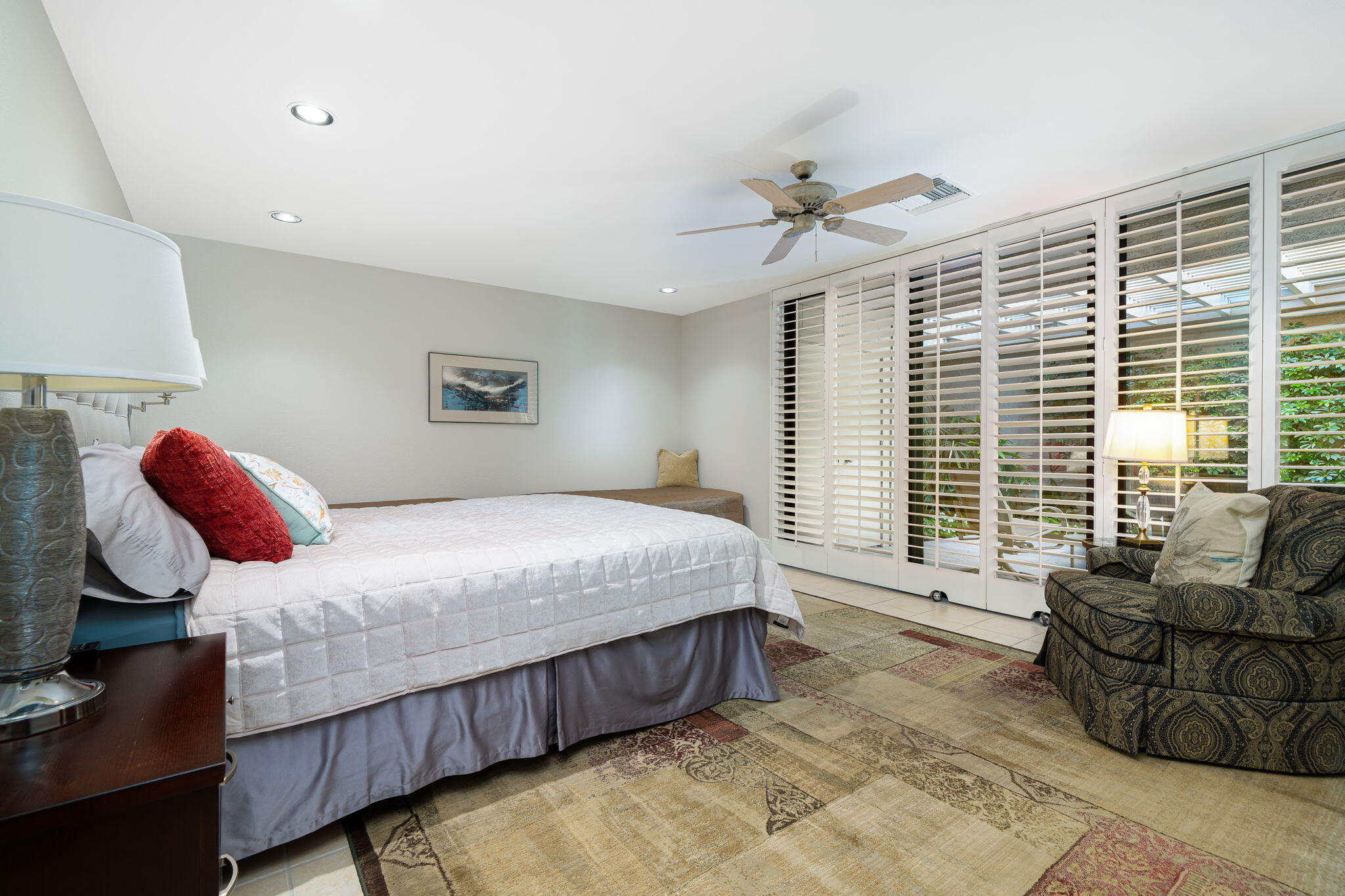 6 Oxford Court Rancho Mirage, CA 92270 - Photo 21 of 42 a bedroom with a bed couch and window