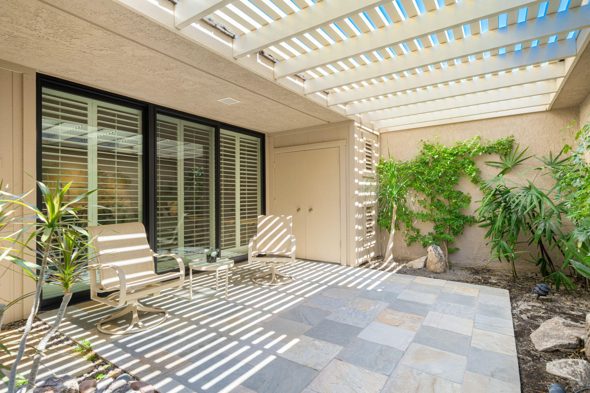 6 Oxford Court Rancho Mirage, CA 92270 - Photo 24 of 42 a view of a house with a backyard