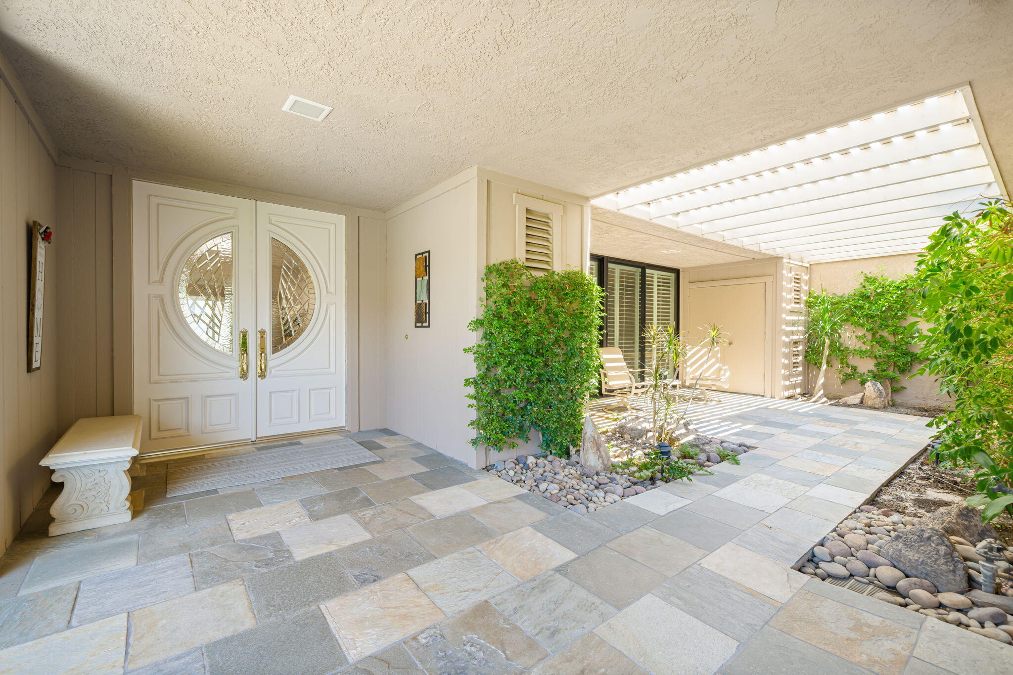 6 Oxford Court Rancho Mirage, CA 92270 - Photo 25 of 42 a view of a room with potted plants