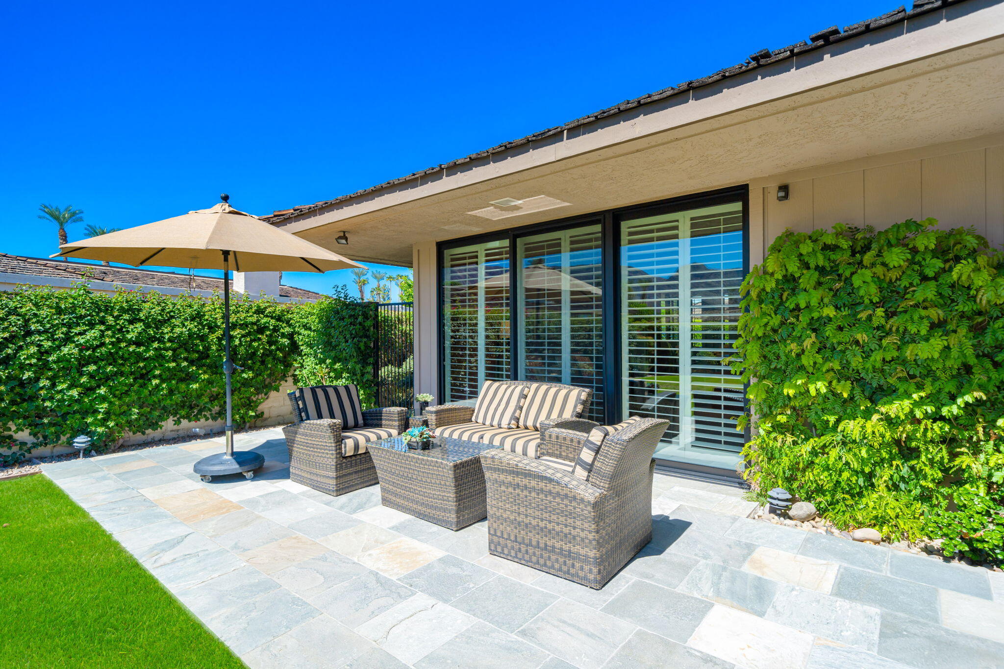 6 Oxford Court Rancho Mirage, CA 92270 - Photo 26 of 42 a view of a patio with couches and potted plants