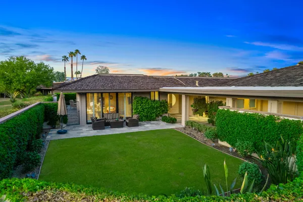 a view of house with a big yard