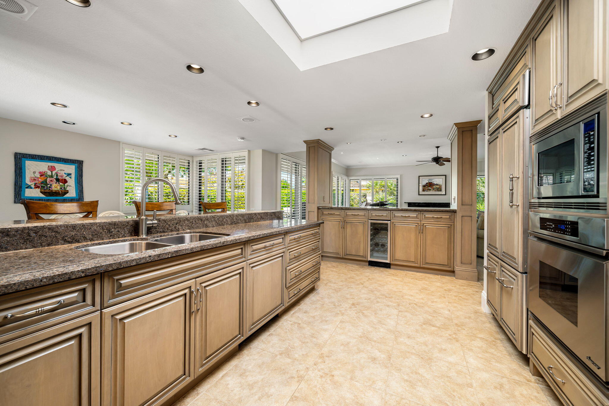 6 Oxford Court Rancho Mirage, CA 92270 - Photo 9 of 42 a large kitchen with stainless steel appliances lots of counter space and a sink