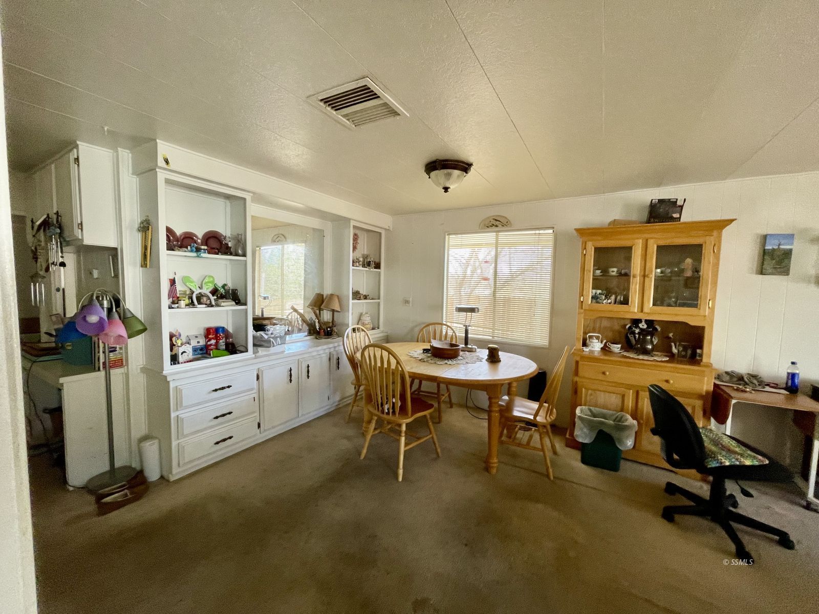 5237 Nolina Avenue Ridgecrest, CA 93555 - Photo 7 of 27 a view of a workspace with furniture and a window