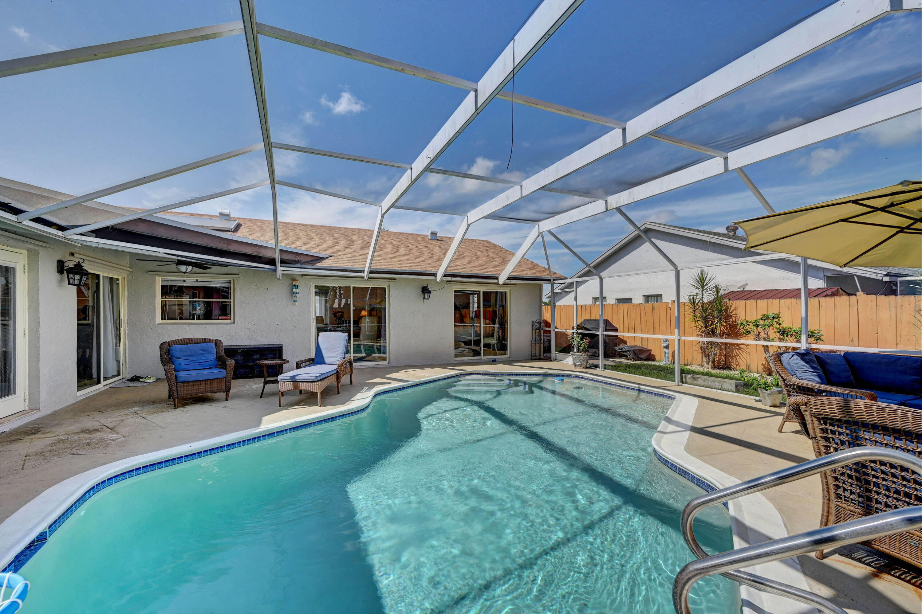 9682 Ohio Place Boca Raton, FL 33434 - Photo 26 of 37 a view of a backyard with a patio and a patio