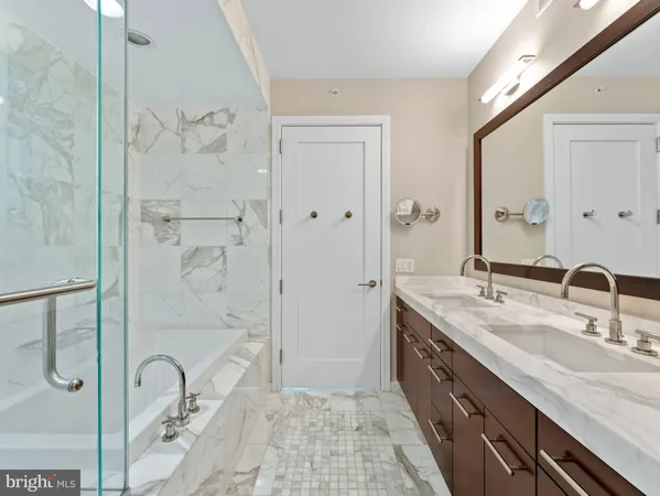 a spacious bathroom with a granite countertop sink mirror and double