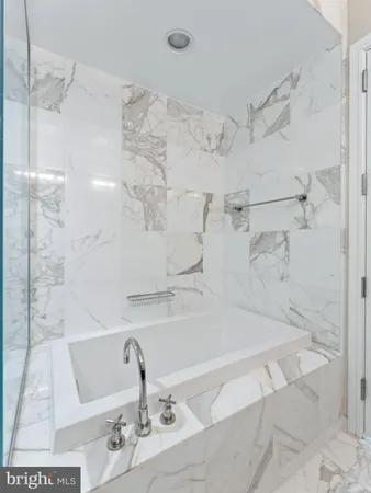 a bathroom with a sink and shower
