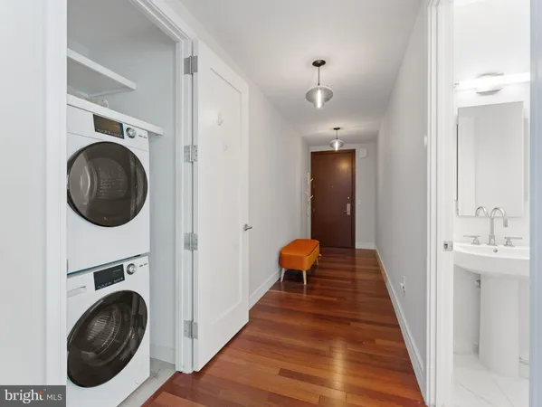 a view of a hallway with washer and dryer