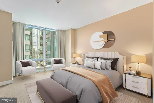a bedroom with bed and a large window