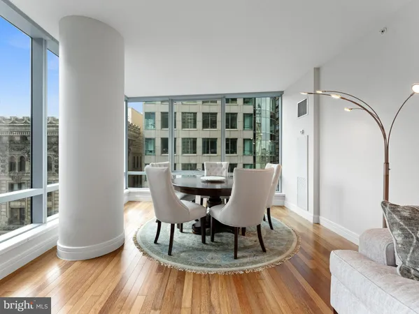 a view of a dining room with furniture window and wooden floor