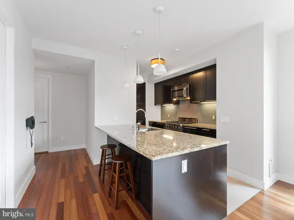 a view of kitchen island with wooden floor