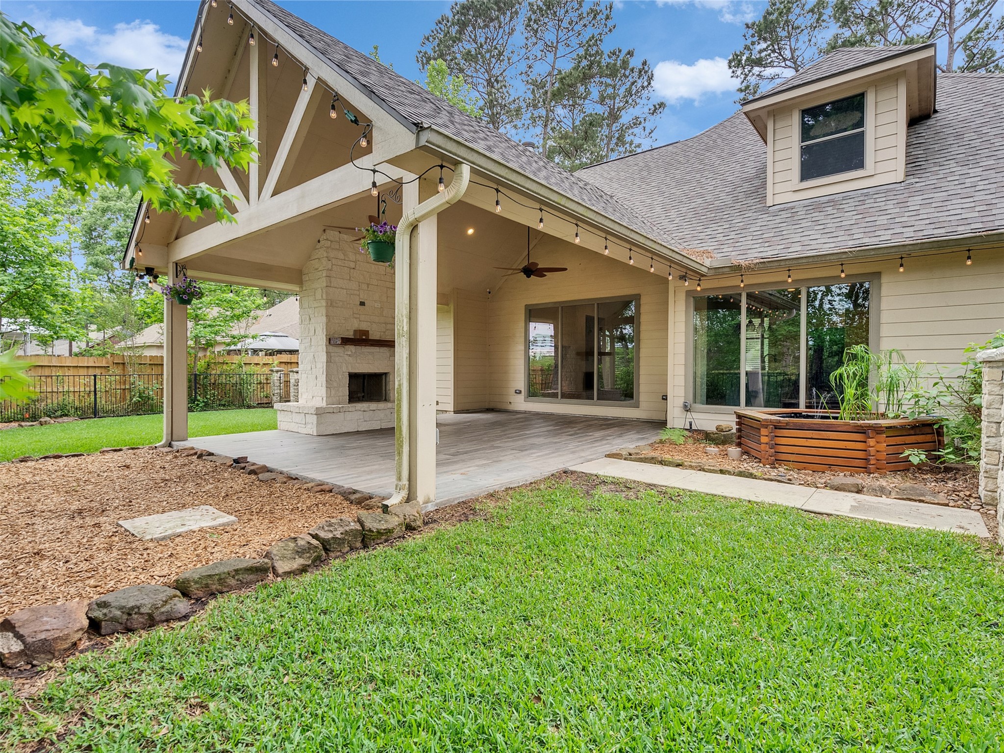 18005 Cindy Lane Conroe, TX 77302 - Photo 42 of 49 What a perfect extension of this home! Great for entertaining and relaxing and includes a fish pond.