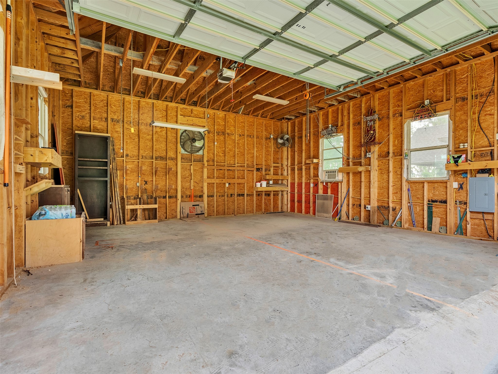 18005 Cindy Lane Conroe, TX 77302 - Photo 45 of 49 Multiple windows for natural light, and ample room for storage or workspace. High ceiling make it ideal for parking vehicles or setting your personal workshop.