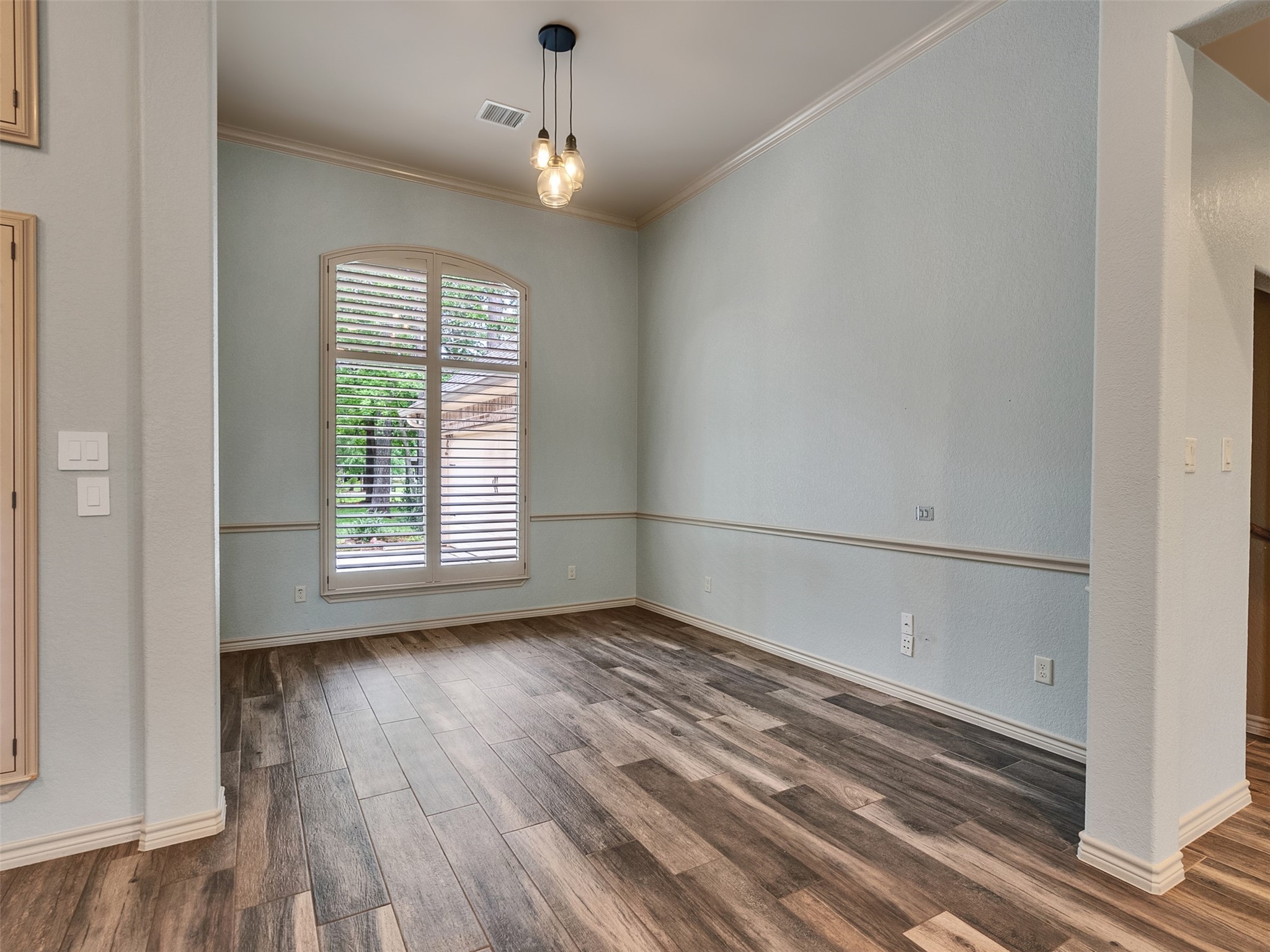 18005 Cindy Lane Conroe, TX 77302 - Photo 7 of 49 This dining room features a large window with shutters providing natural light, creating a bright and inviting space.