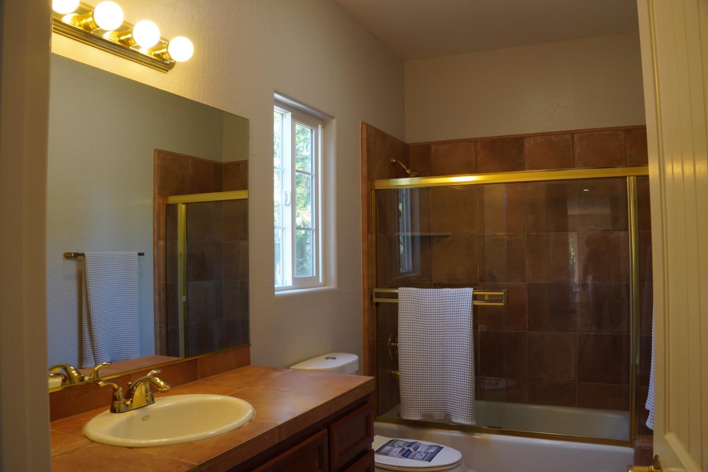 389 Corralitos Road Watsonville, CA 95076 - Photo 11 of 18 a bathroom with a sink and a mirror