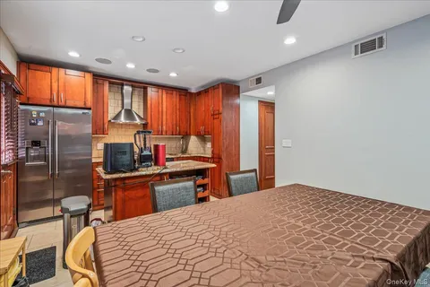 a bedroom with a bed and wooden furniture