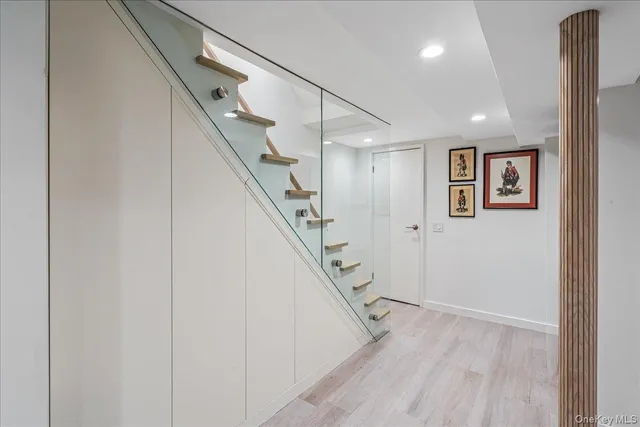a view of entryway with stairs and wooden floor