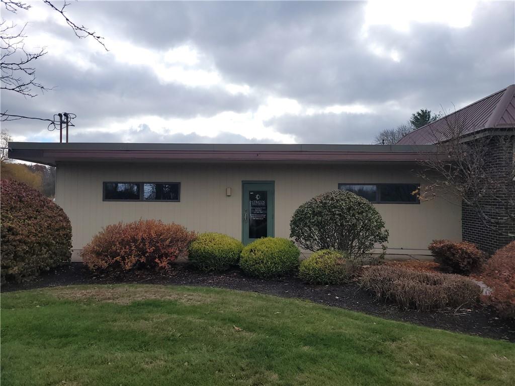 1235 South Center Street Extension, Unit B Grove City, PA 16127 - Photo 1 of 11 a front view of a house with garden