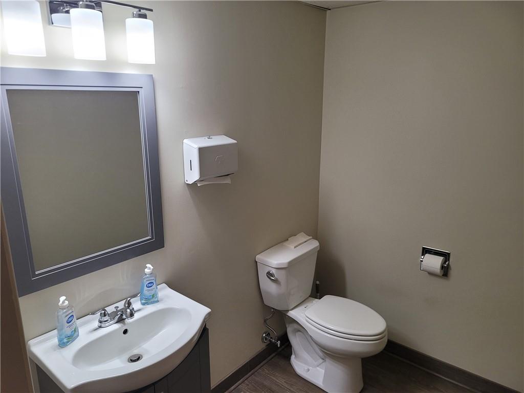 1235 South Center Street Extension, Unit B Grove City, PA 16127 - Photo 4 of 11 a bathroom with a toilet sink and mirror