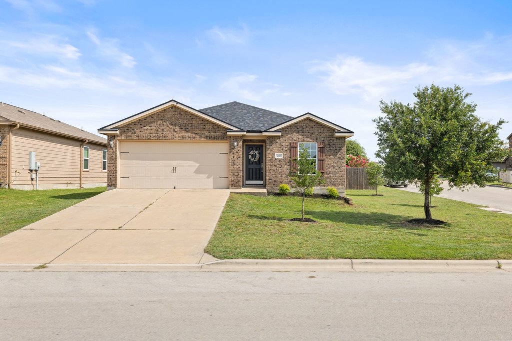 217 Farmer Lane Jarrell, TX 76537 - Photo 1 of 29 A classic brick exterior with an attached garage on a large corner lot.