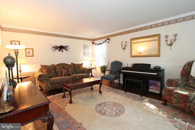 12504 Arbor View Terrace Silver Spring, MD 20902 - Photo 6 of 18 a living room with furniture a rug and a window