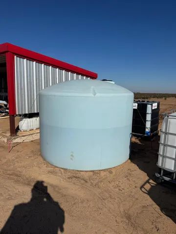 a view of a swimming pool and furniture
