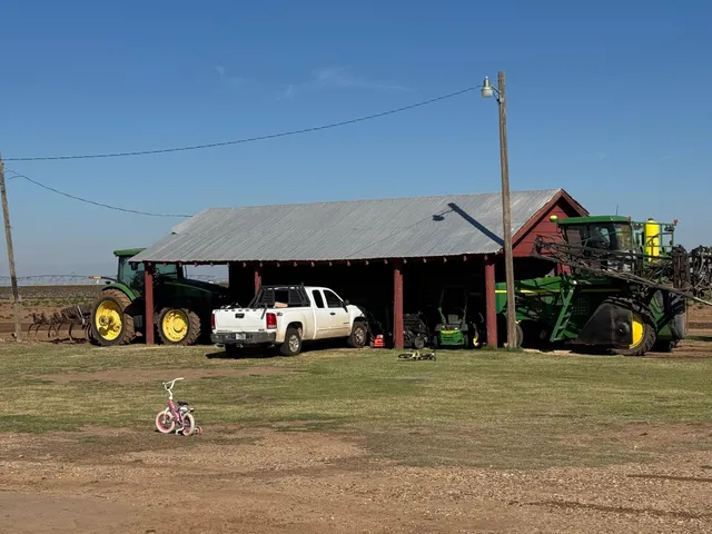 a front view of a house with a garden and yard