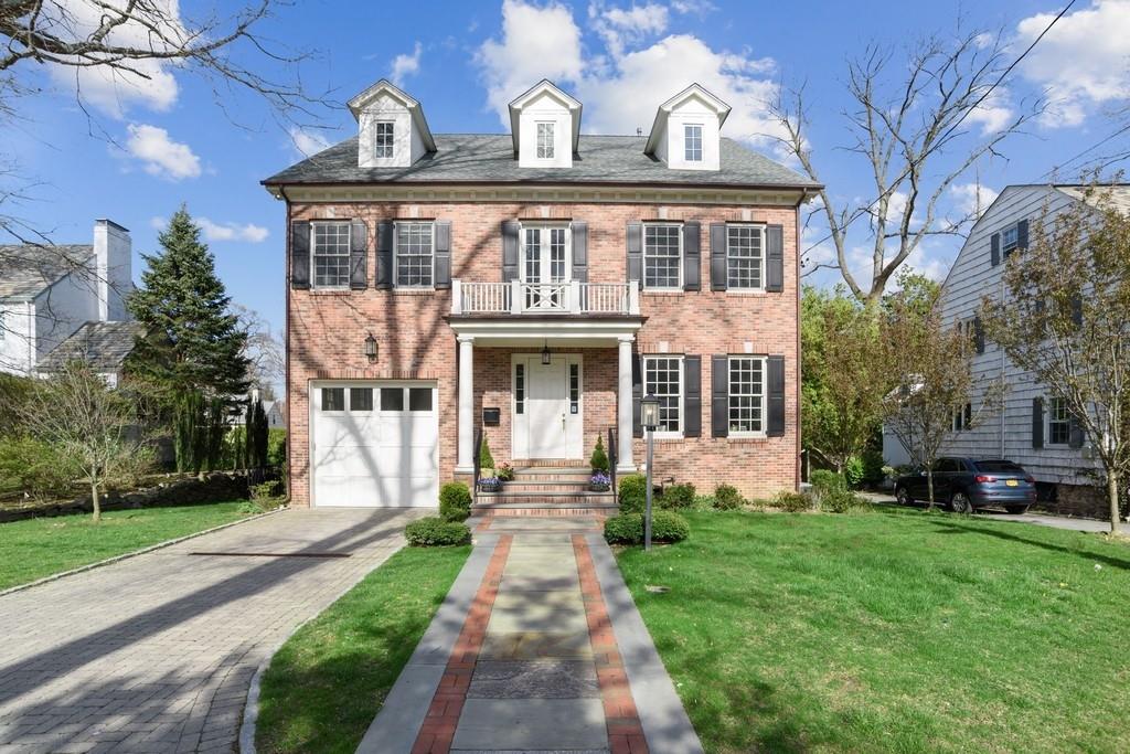 38 Forest Lane Bronxville, NY 10708 - Photo 1 of 1 a front view of a house with a yard and potted plants