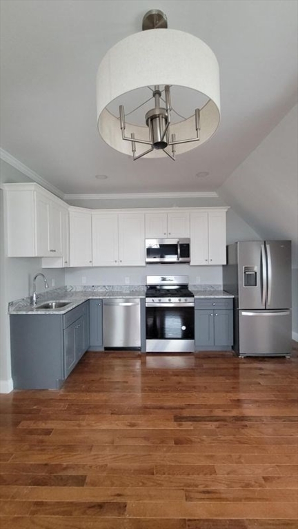 761 Highland Avenue, Unit 7 Fall River, MA 02720 - Photo 1 of 7 a kitchen with stainless steel appliances a large counter top a stove and cabinets