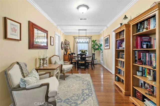 a living room with fireplace furniture and a book shelf
