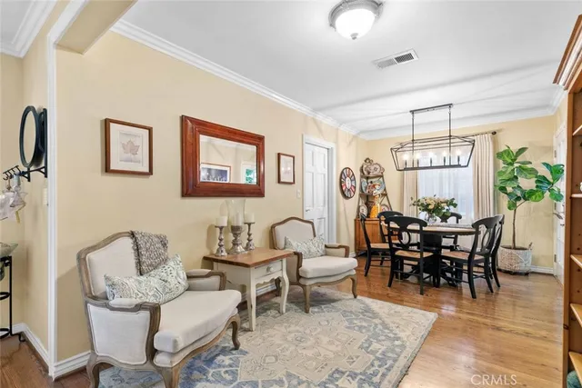 a dining room with furniture and a book shelf