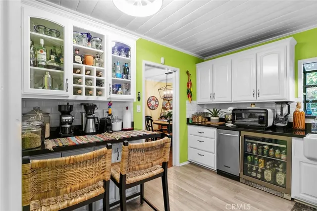 a living room with furniture a ceiling fan and a window