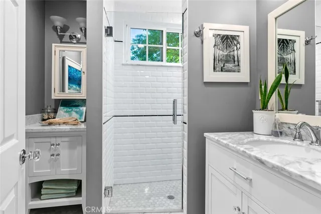 a bedroom with a large bed and wooden floor