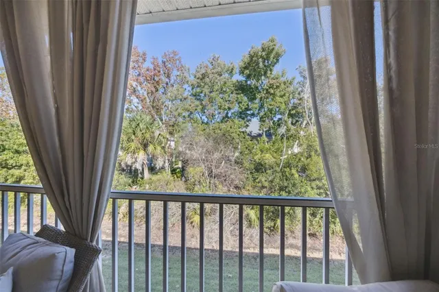 a swimming pool with outdoor seating and yard
