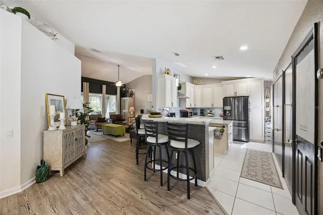 a view of a dining area with furniture and wooden floor